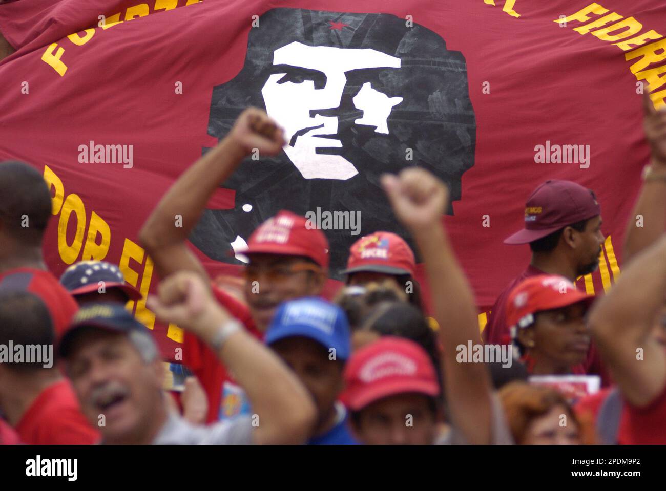 Supporters of Venezuela's President Hugo Chavez rally outside the Supreme  Court with a flag of Argentine revolutionary leader Ernesto Che Guevara  in Caracas, Venezuela, Thursday, Oct. 27, 2005, where the court is