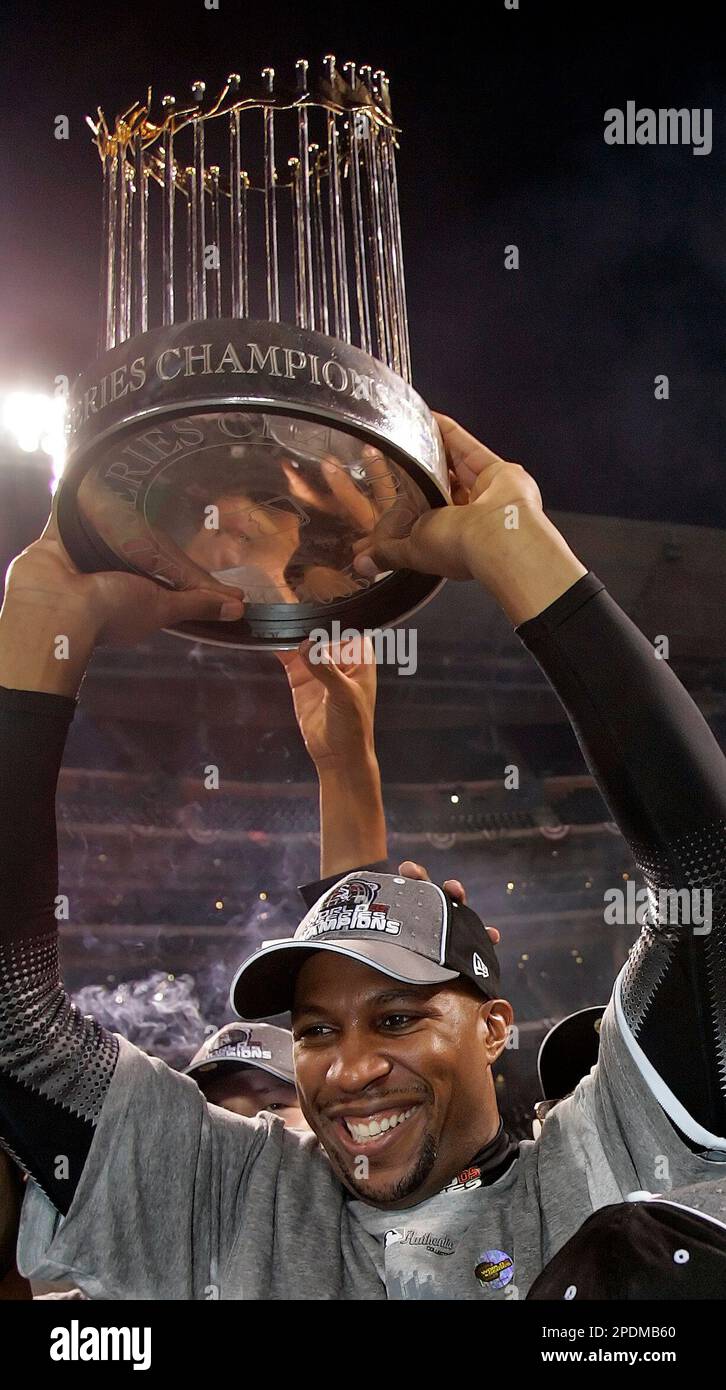 Chicago White Sox's Jermaine Dye holds up the World Series trophy after the White  Sox defeated the Houston Astros in Game 4 to win the World Series for the  first time since