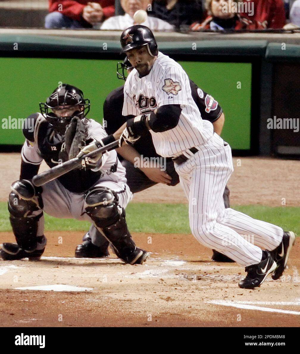 Houston Astros' Willy Taveras bunts over teammate Craig Biggio in the first  inning of Game 4 of the World Series against the Chicago White Sox  Wednesday, Oct. 26, 2005 in Houston. Derryl