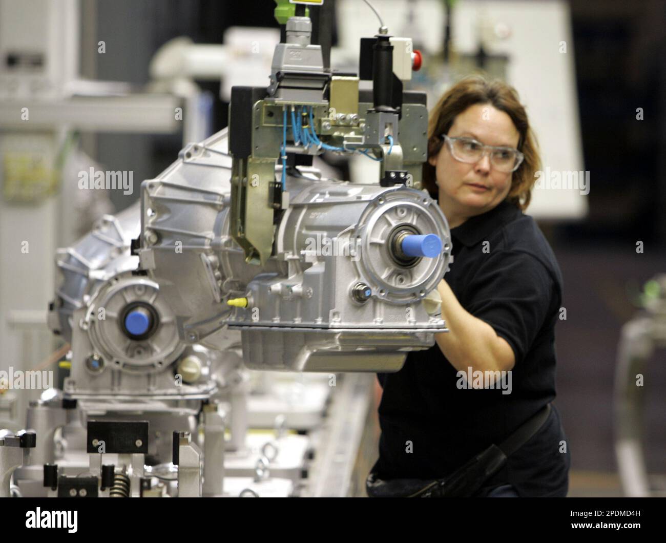 Donna Ramsey moves transmissions in the final assembly area at the