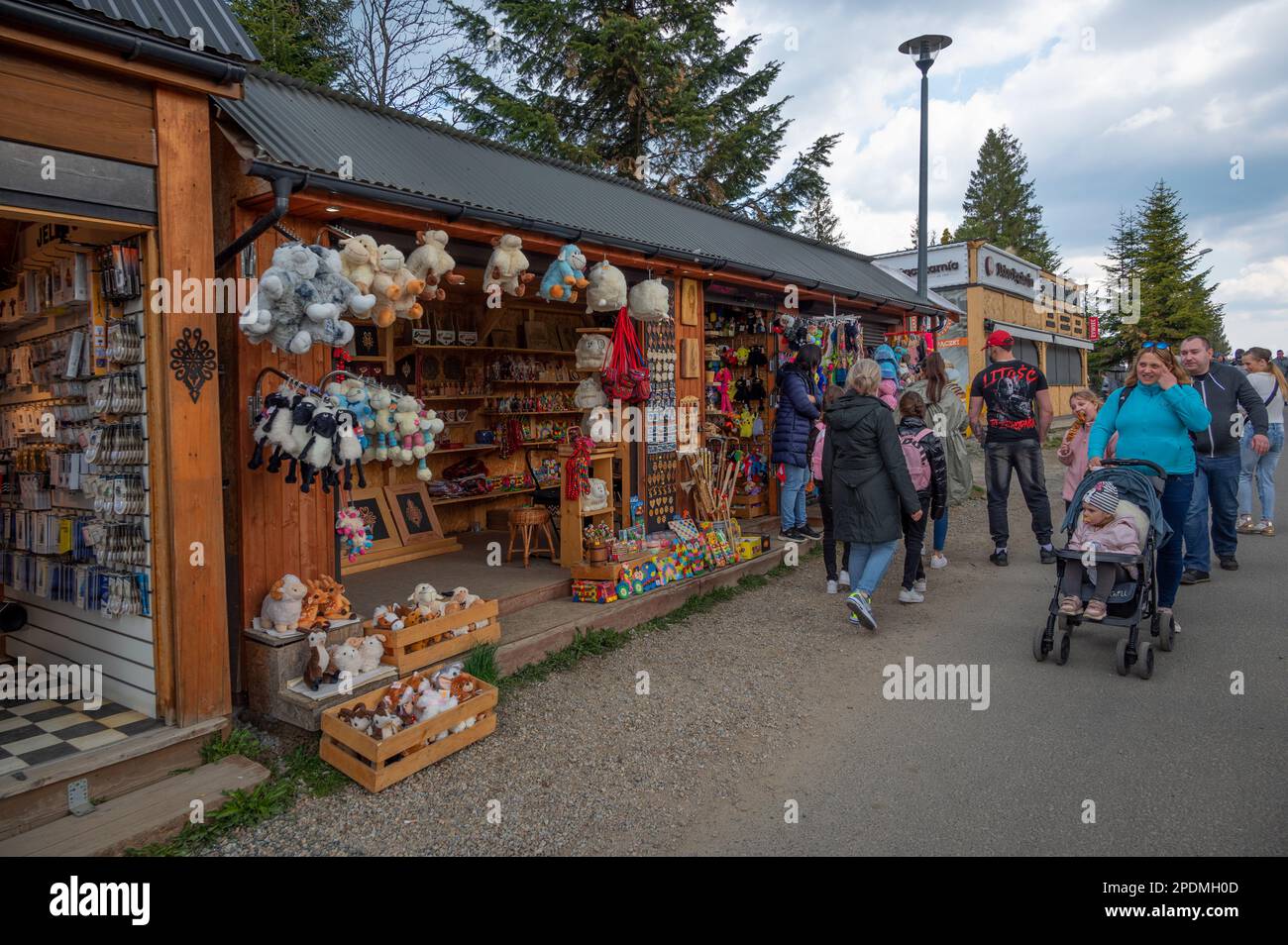 View of a Souvenir shop on the streets selling winter clothes, colorful magnets, stuffed toys and collectibles captured at Zakopane, Poland. Stock Photo