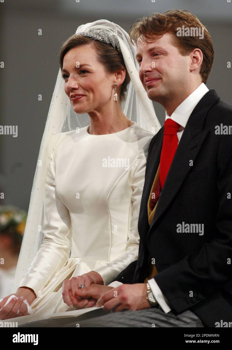 Aimee Sohngen, left,and Prince Floris, listen to Ave Maria during their  church wedding ceremony in Naarden, the Netherlands, Saturday, Oct. 22,  2005. Floris is the youngest son of Princess Margriet, sister of, image size:921x1390