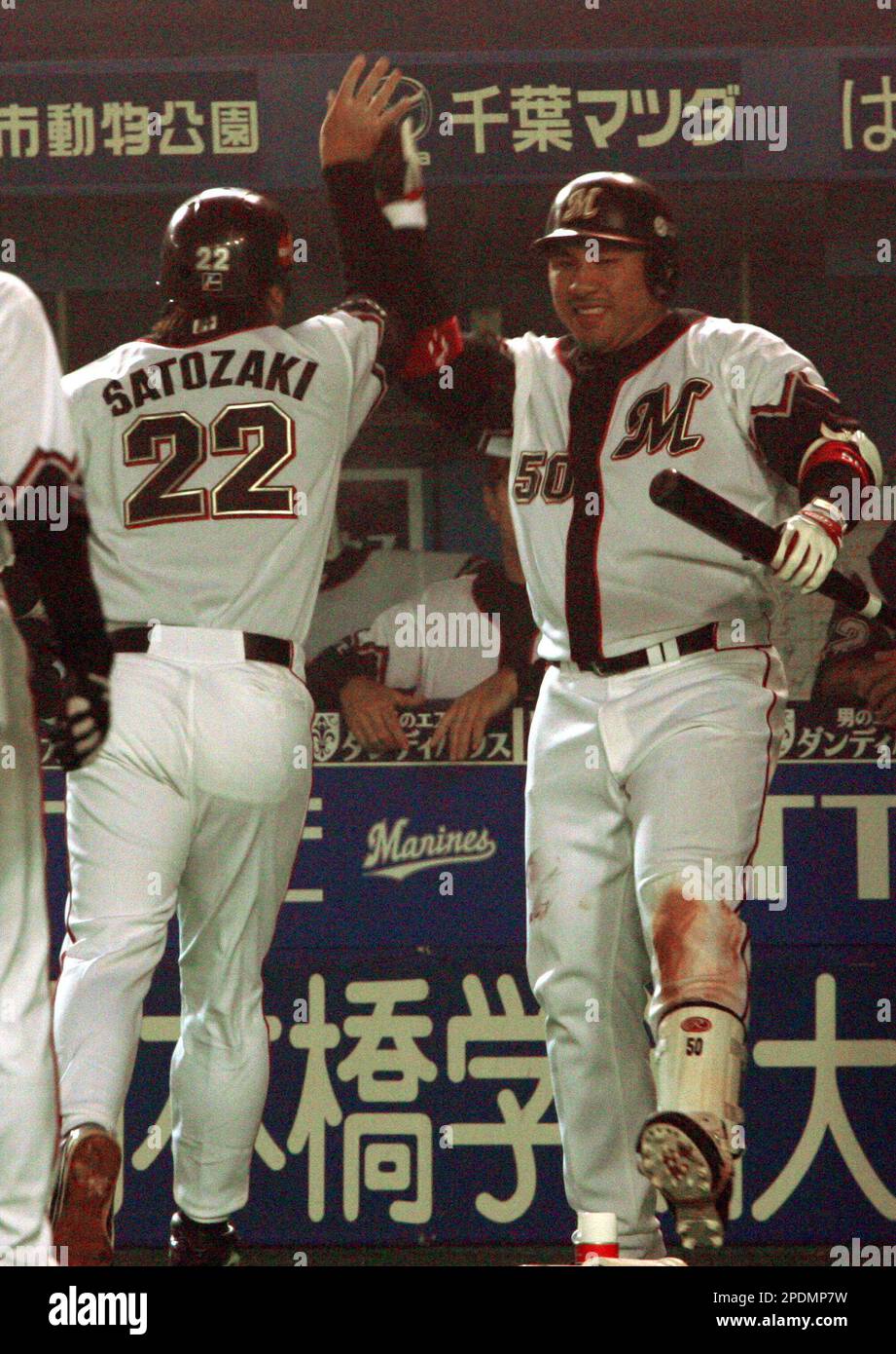 TOKYO, Japan - Benny Agbayani of the Lotte Marines responds to fans after  being named the MVP after the team beat the Samsung Lions of South Korea  5-3 to win the inaugural