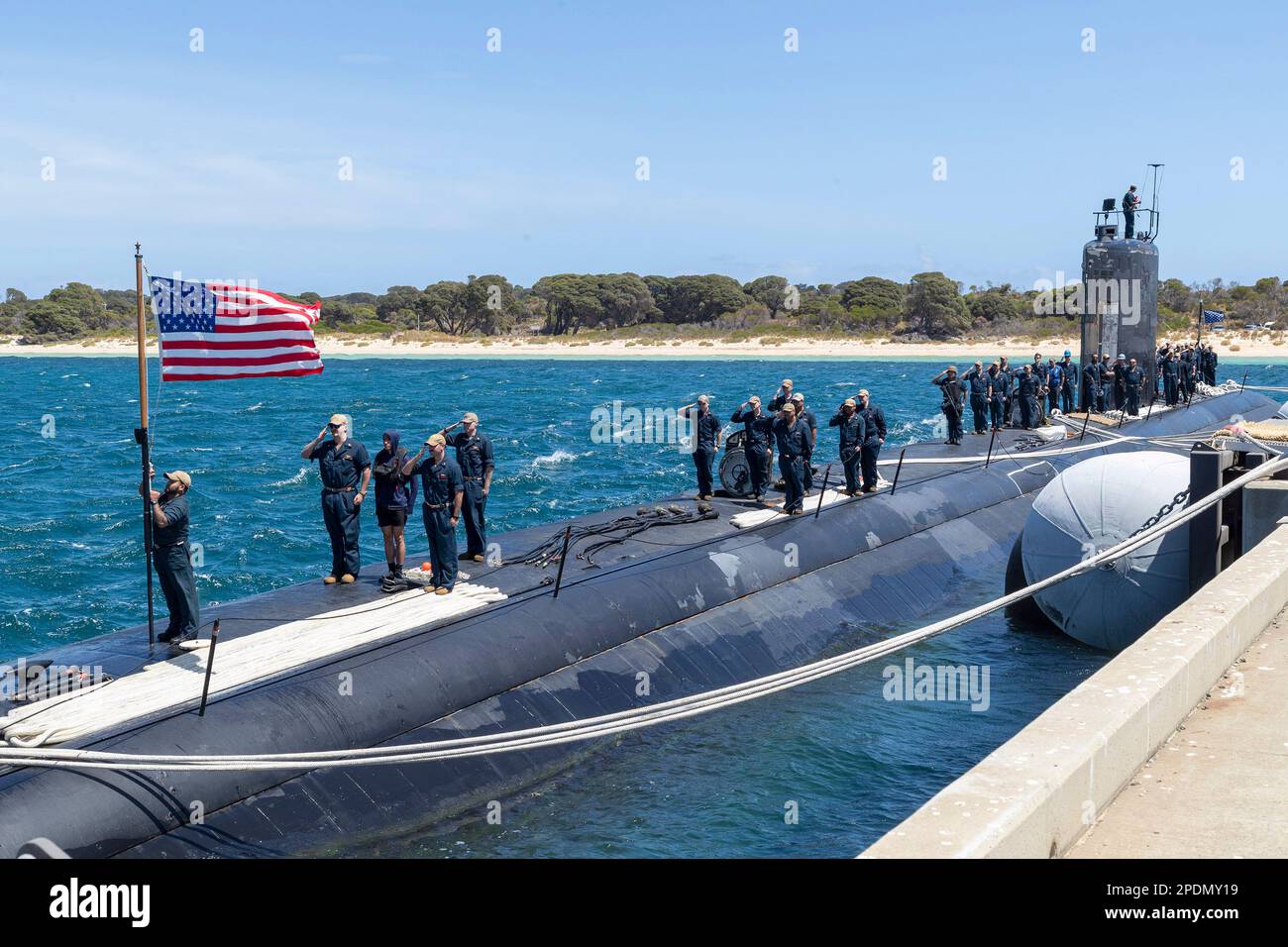 Garden Island, Australian Capital Territory, Australia. 27th Feb, 2023. Sailors assigned to the Los Angeles-class fast-attack subMarchine USS Asheville (SSN 758) salute the national ensign after arriving at Royal Australian Navy HMAS Stirling Naval Base, February. 27. Asheville is currently on patrol in support of national security interests in the U.S. 7th Fleet area of operations. Credit: Australia Department of Defence/ZUMA Press Wire Service/ZUMAPRESS.com/Alamy Live News Stock Photo