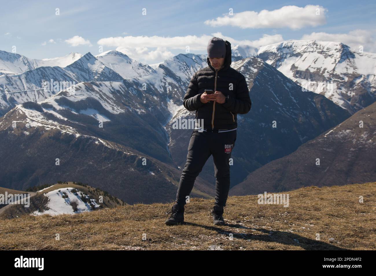 BOLOGNOLA, ITALY - MARCH 13, 2023: Panoramic view of Sibillini mountains with snow in the Marche region, during spring season, Italy Stock Photo