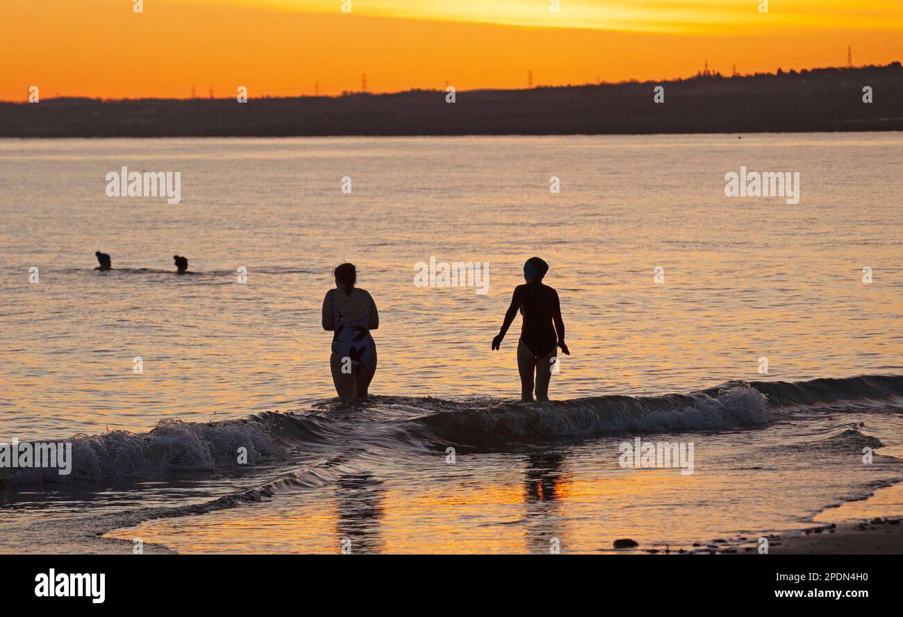 Portobello, Edinburgh, Scotland, UK. 15th March 2023. Temperature minus 4 degrees centigrade made for a freezing dawn at the seaside by the Firth of Forth for those brave enough to venture out for a cold water swim. Within an hour the sun had disappered behind a veil of cloud. Credit: Archwhite/alamy live news. Stock Photo
