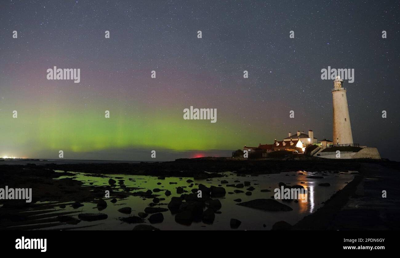 The aurora borealis, also known as the northern lights, glow on the