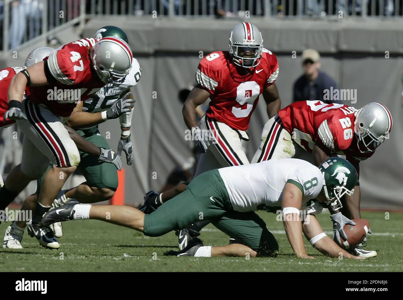 Notre Dame Jeff Samardzija (83) runs after catching a pass then is brought  down by Ohio State's Ashton Youboty (26) in the fourth quarter of the  Fiesta Bowl January 2, 2006 in