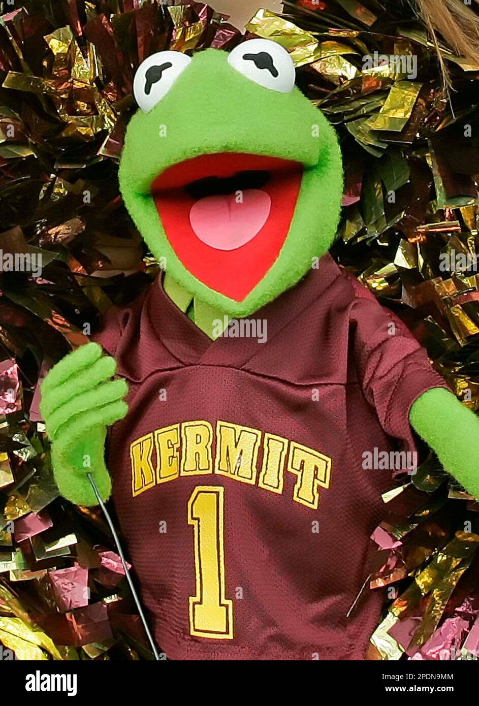 The Kermit High School varsity cheerleaders, unseen, surround Kermit