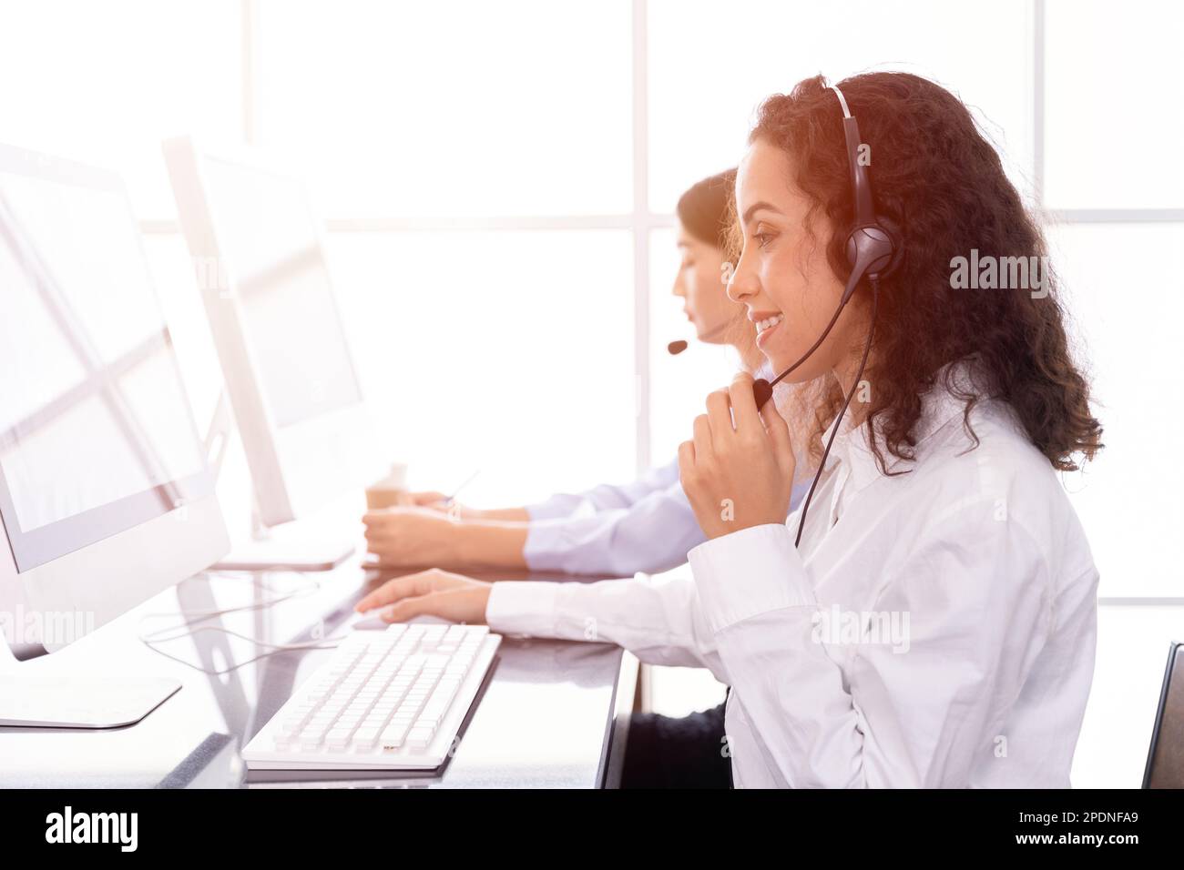 call center woman happy service working. customer support team staff enjoy to help and contact using CRM software.sale agent people. Stock Photo