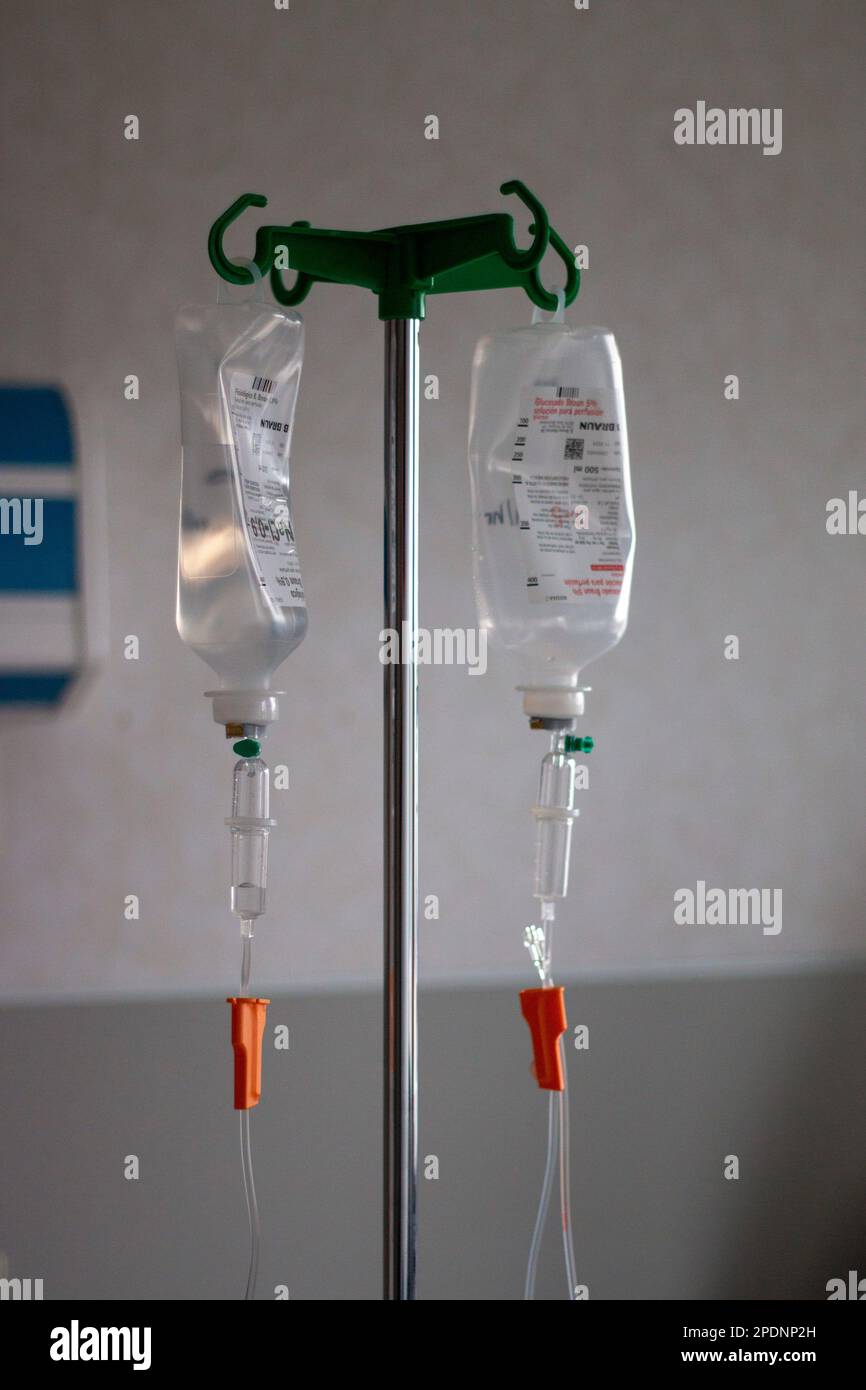 Saline saline bags hung and ready to be administered to the patient