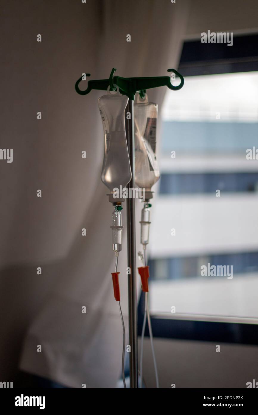 Saline saline bags hung and ready to be administered to the patient