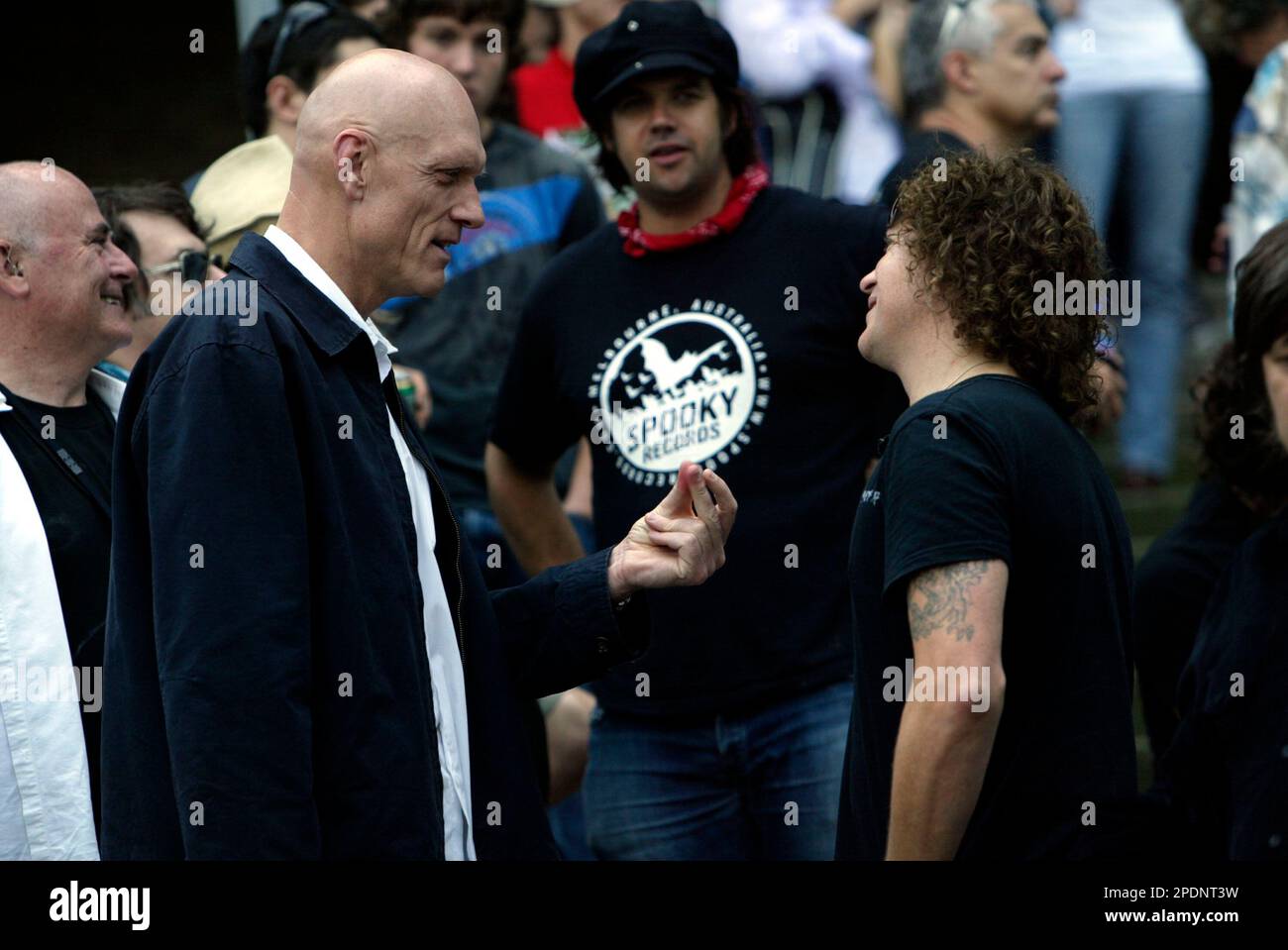 Peter Garrett (left), Australian Labor Party minister and vocalist with politically motivated rock group Midnight Oil, speaking to Dave Gleeson of the Screaming Jets backstage at the Rockin' 4 Rights concert at Sydney Cricket Ground to a 40,000-strong crowd protesting the Liberal (conservative) government’s Industrial Relations policies and changes to workplace laws. A protest march through the streets of Sydney’s city centre preceded the concert. Sydney, Australia. 22.04.07. Stock Photo