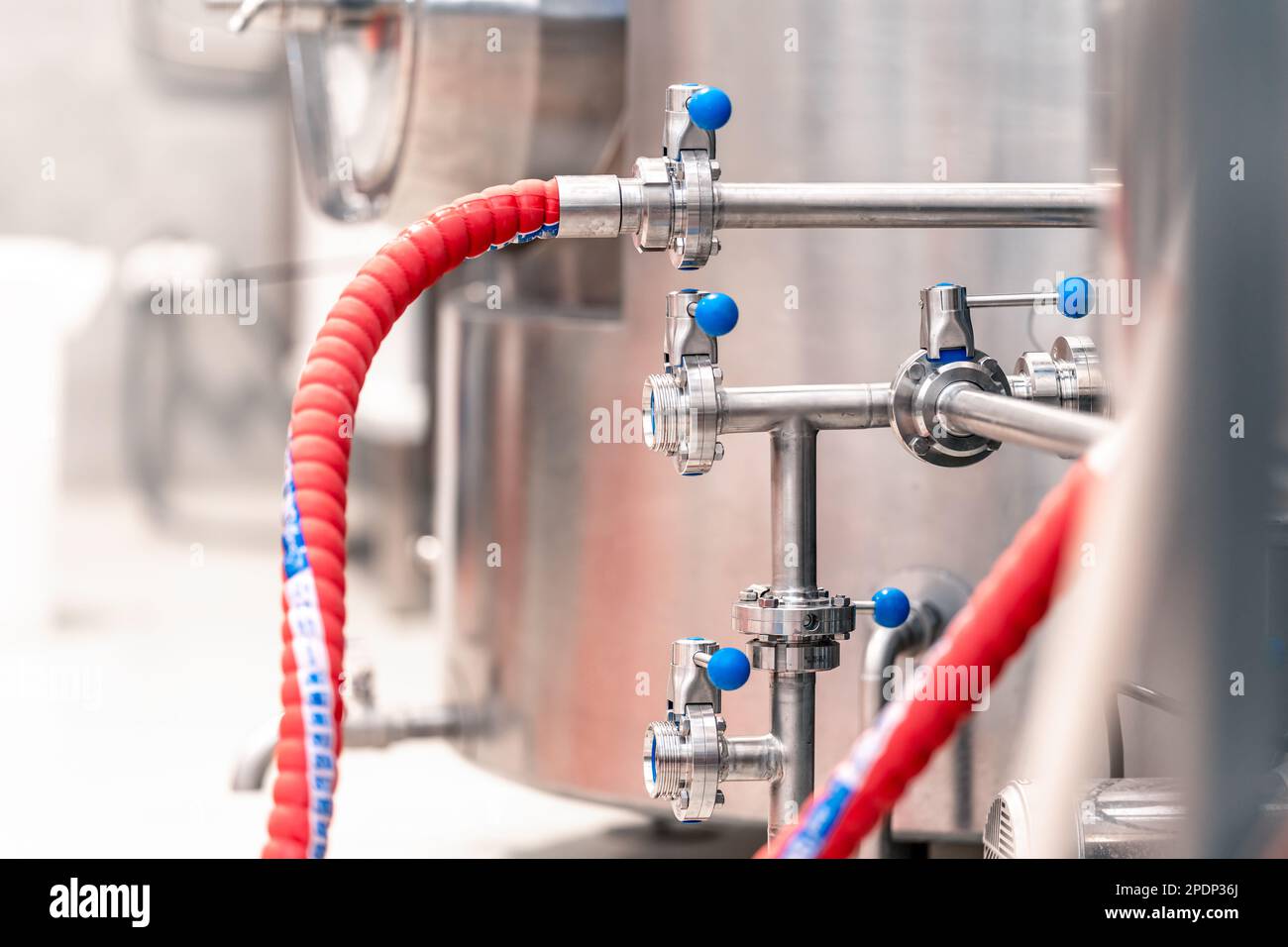 stainless steel boilers and vessels with pipes for brewing beer in a