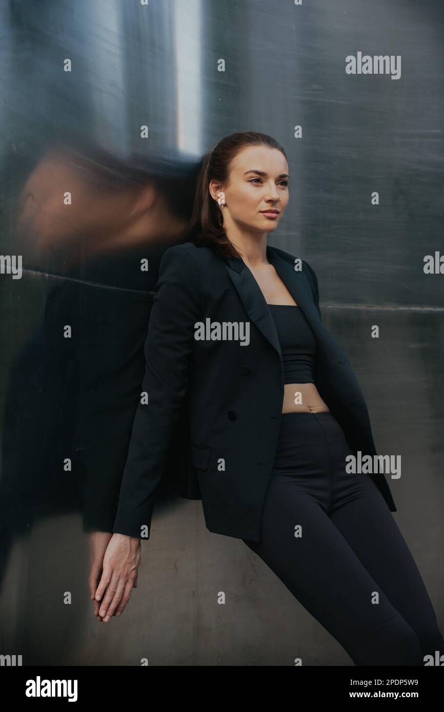 Girl in black suit hi-res stock photography and images - Alamy