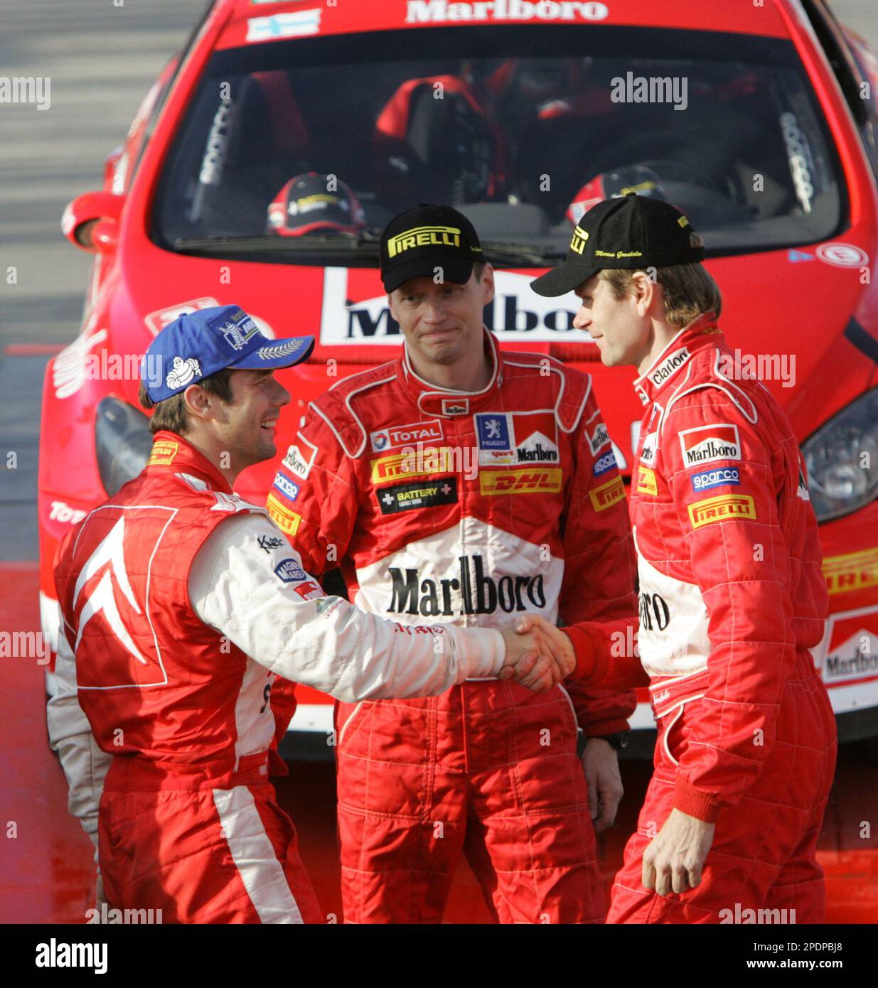 Winner Finnish driver Marcus Gronholm, right, shakes hands with second