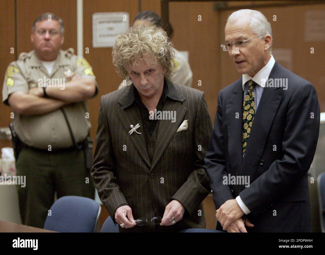 Rock music producer Phil Spector, center, charged with fatally shooting ...