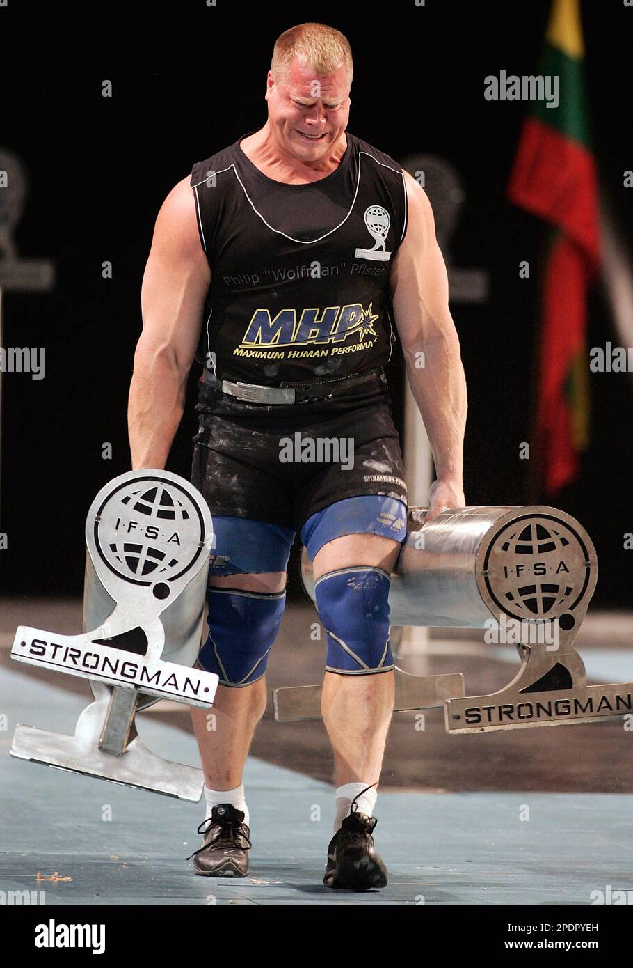 United States' Phil Pfister carries the 320kg weights to place second in  the Farmer's walk event at the IFSA Strongman World Championships Sunday  Sept. 25, 2005, in Quebec City. (AP Photo/Jacques Boissinot