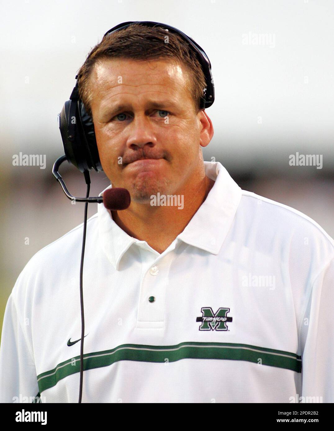 Marshall coach Mark Snyder paces the sideline during the second quarter