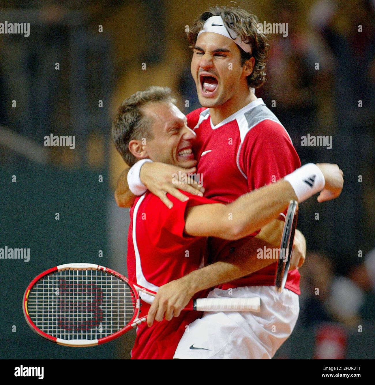 Tennis player Roger Federer of Switzerland, right, and teammate Yves  Allegro celebrate during their Davis Cup World Group Play-off double  against Great Britain in Geneva, Switzerland, on Saturday, Sept. 24, 2005.  (AP