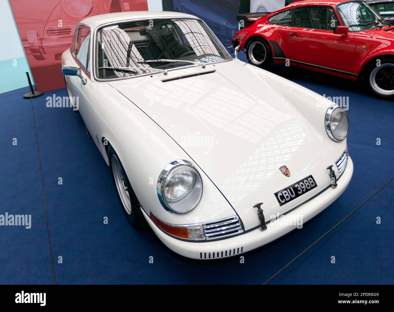 Three-quarters front view of a White, 1964, Porsche 911 (Type 901), on display at the 2023  London Classic Car Show Stock Photo