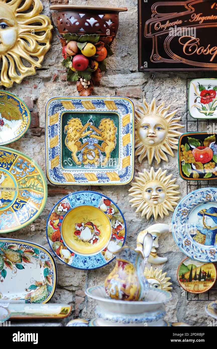 LUCCA, ITALY MAY 2011 Painted ceramic dishes on a showcase. Typical