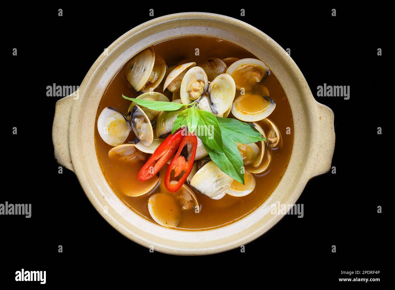 Steamed clams or clam soup cooked in vietnamese style isolated on black