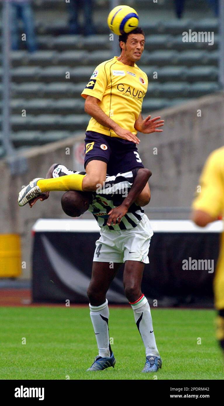 Ascoli's Corrado Colombo heads the ball and falls on Juventus's Patrick