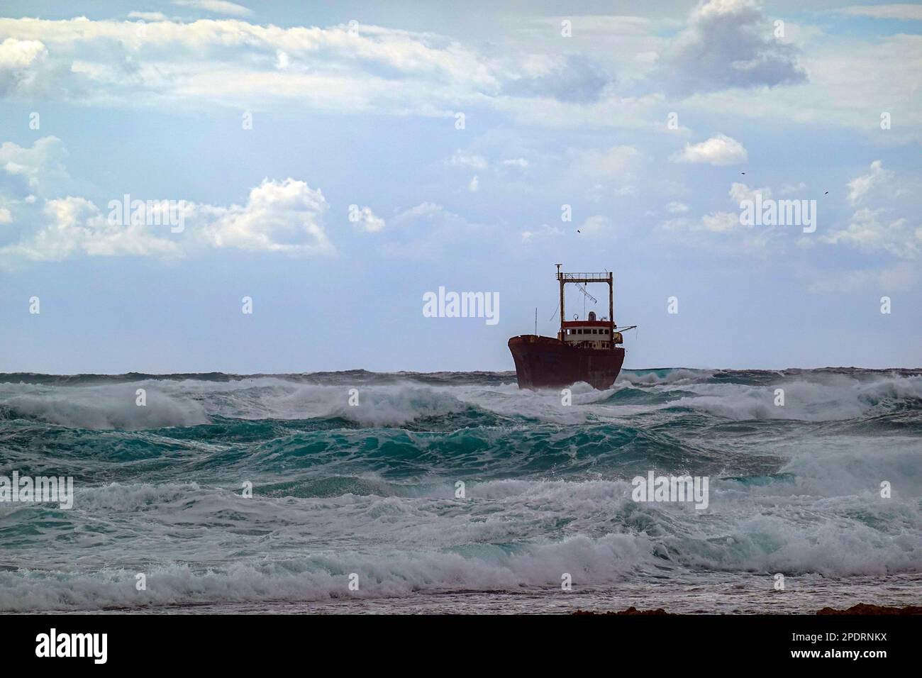 Stormy weather and shipwreck, near Phaphos Pafos area of Cyprus in the winter, winter sun Stock Photo