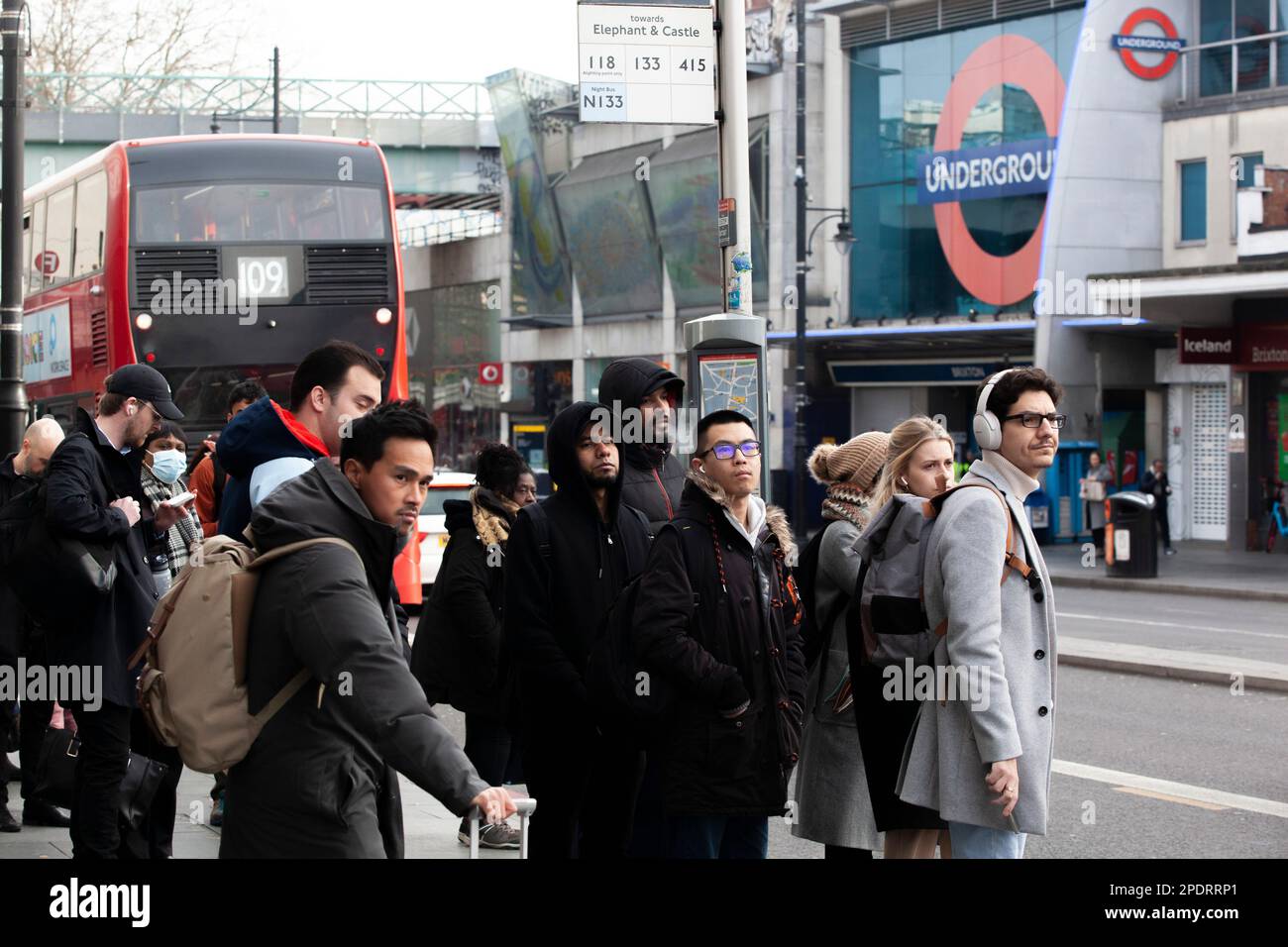 London, UK, 15 March 2023: The RMT and Aslef unions are on strike, completely closing the London Underground today, with a picket line at Brixton station. Commuters squeezed on to buses but sometimes they arrived too full to take on any more passengers. Anna Watson/Alamy Live News Stock Photo