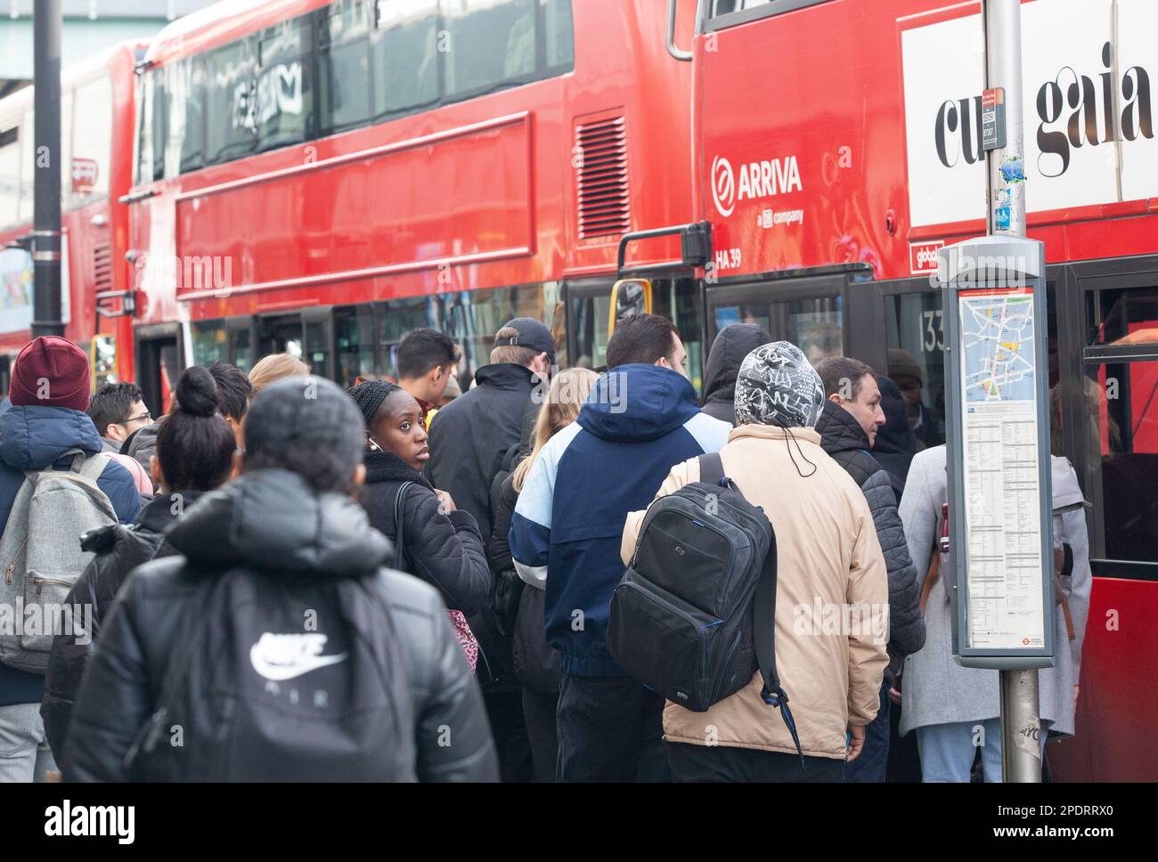 London, UK, 15 March 2023: The RMT and Aslef unions are on strike, completely closing the London Underground today, with a picket line at Brixton station. Commuters squeezed on to buses but sometimes they arrived too full to take on any more passengers. Anna Watson/Alamy Live News Stock Photo