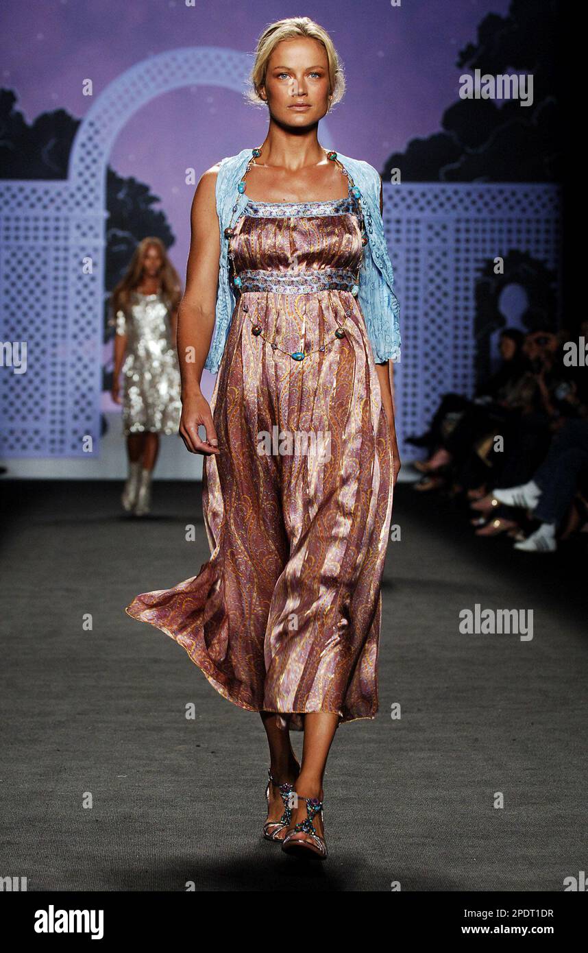 Carolyn Murphy wears a blue crushed silk combo vest and orchid metallic  paisley print pleated dress at the showing of the Anna Sui spring 2006  collection during Fashion Week, Wednesday, Sept. 14,