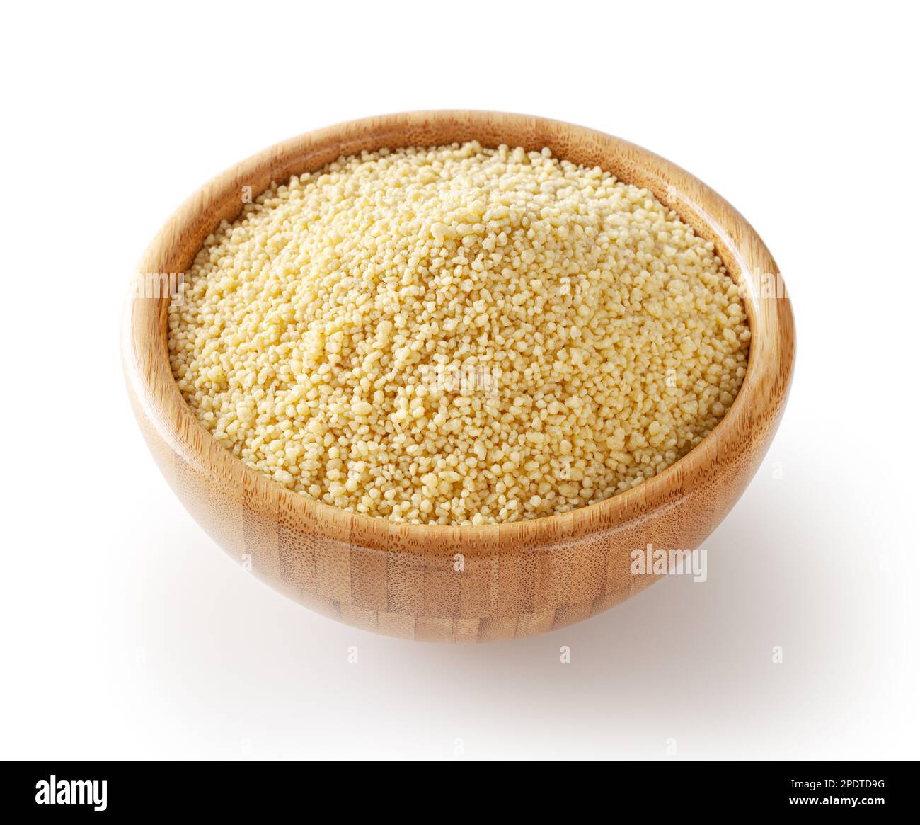Uncooked dried cous cous in wooden bowl isolated on white background with clipping path Stock Photo
