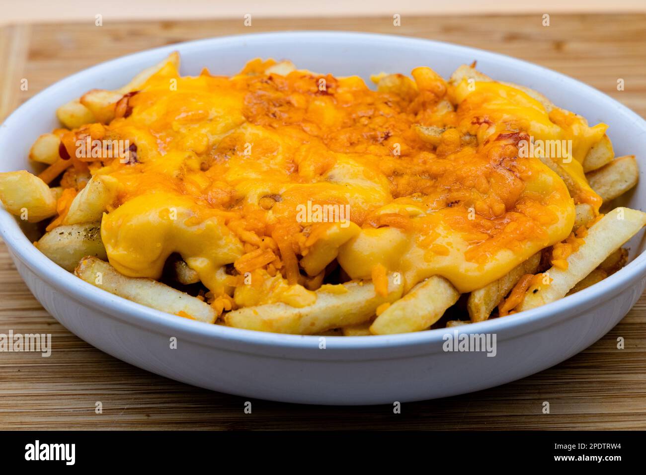 Cheesy Chips Chips with Melted and grilled Cheese Stock Photo Alamy