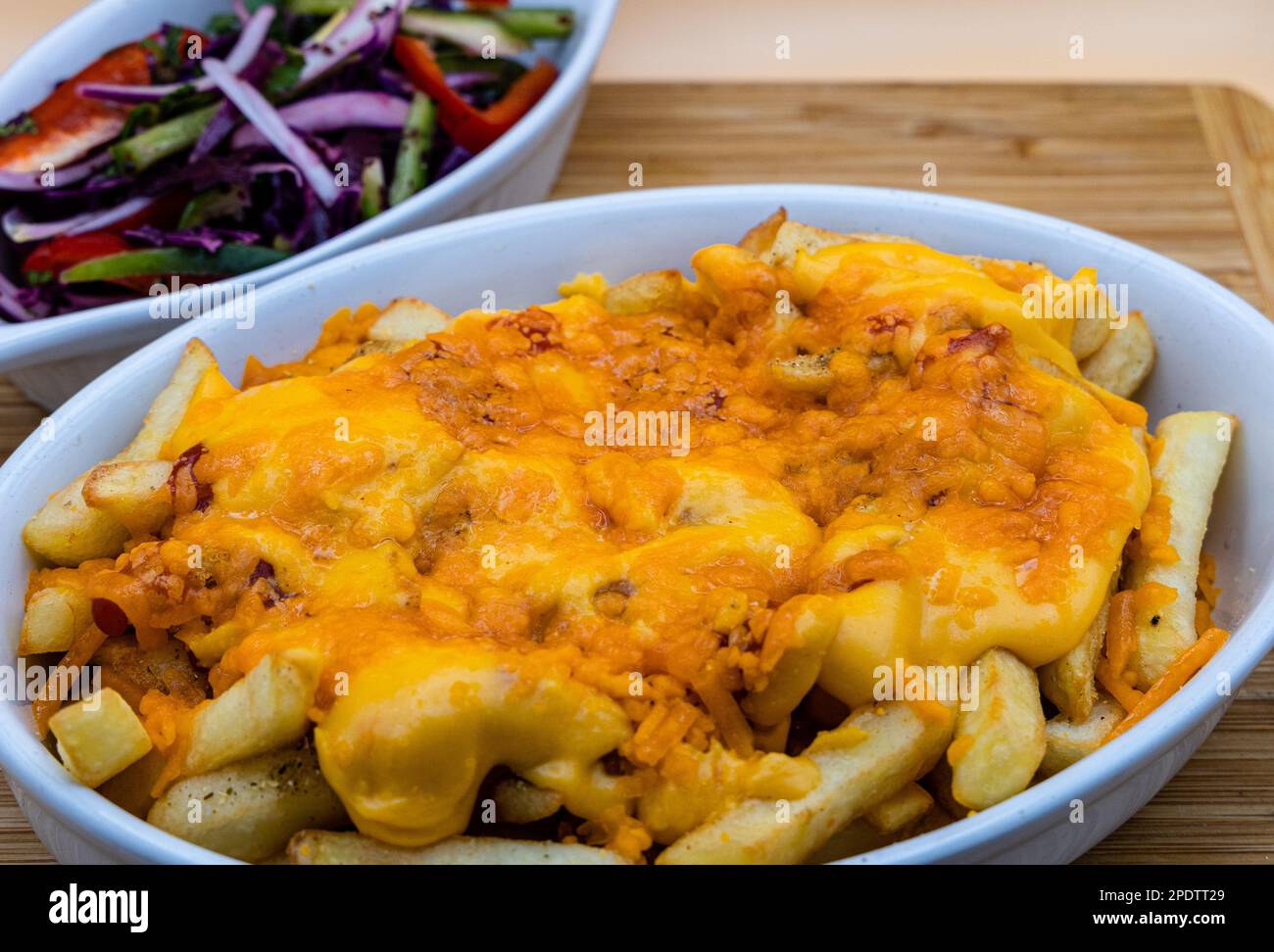 Cheesy Chips Chips with Melted and grilled Cheese Stock Photo Alamy