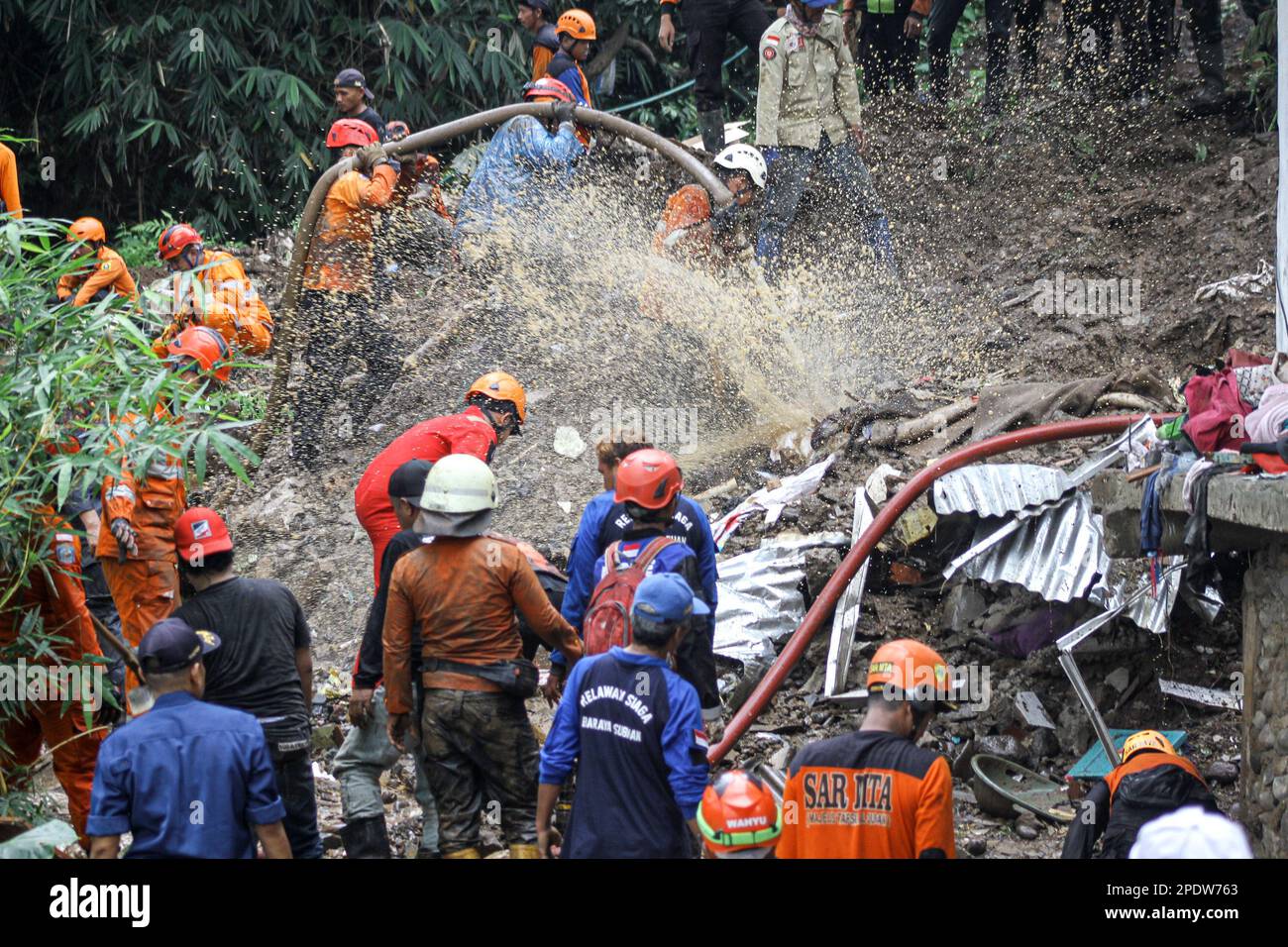 Bogor, Indonesia. 15th Mar, 2023. Search and rescue team members look for victims after a landslide hit Empang village in Bogor, West Java, Indonesia, March 15, 2023. Credit: Sandika Fadilah/Xinhua/Alamy Live News Stock Photo