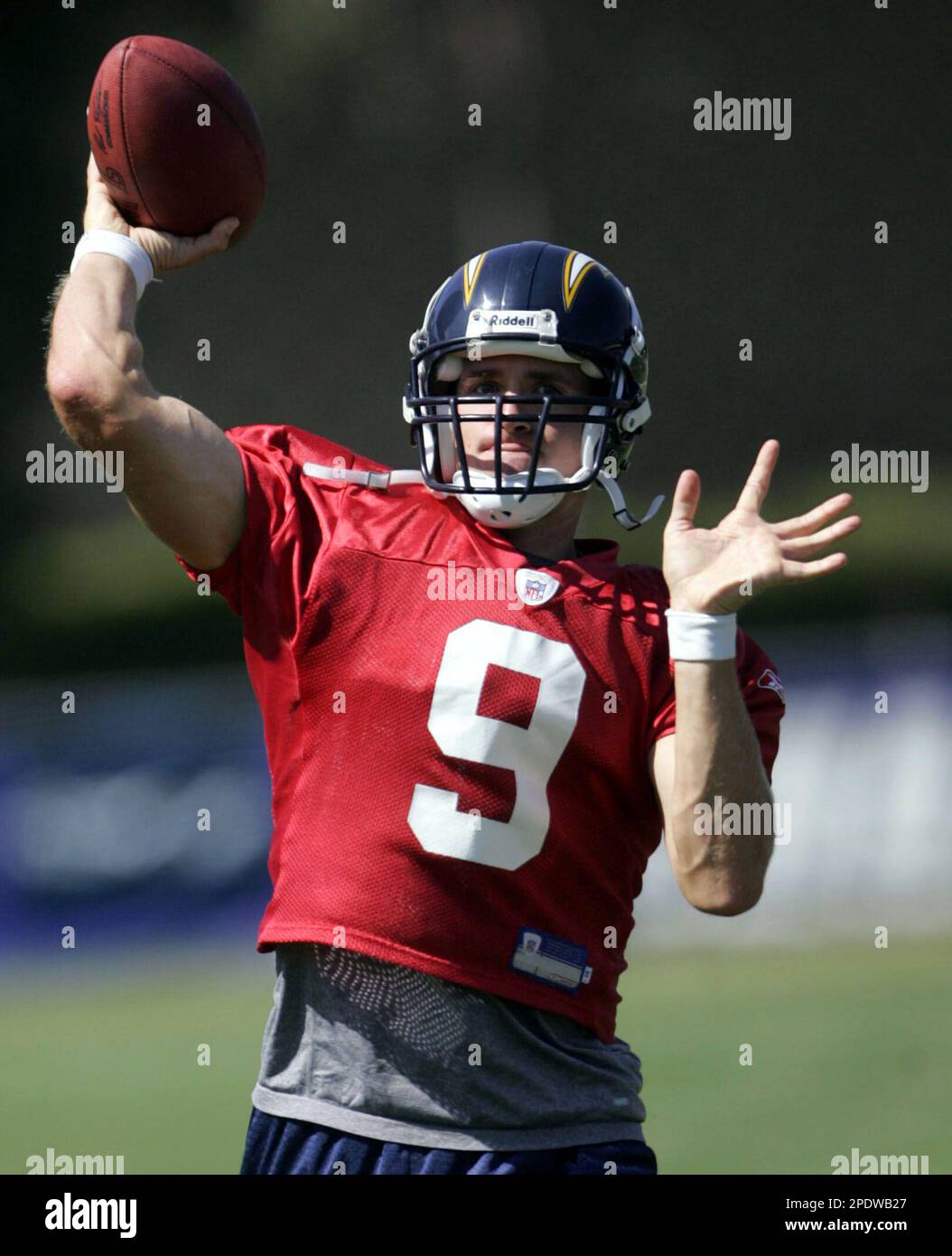 San Diego Chargers pro bowl quarterback Drew Brees tooses a pass during  drills at the team's training camp Tuesday Aug. 16, 2005 in San Diego. The  Chargers placed the franchise tag on