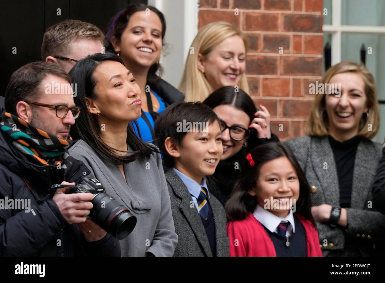 Lucy Hunt, second left the wife of Britain's Chancellor of the Exchequer Jeremy Hunt with two of her children watch as he leaves 11 Downing Street for the House of Commons to deliver the Budget In London, Wednesday, March 15, 2023. (AP Photo/Frank Augstein) Stock Photo