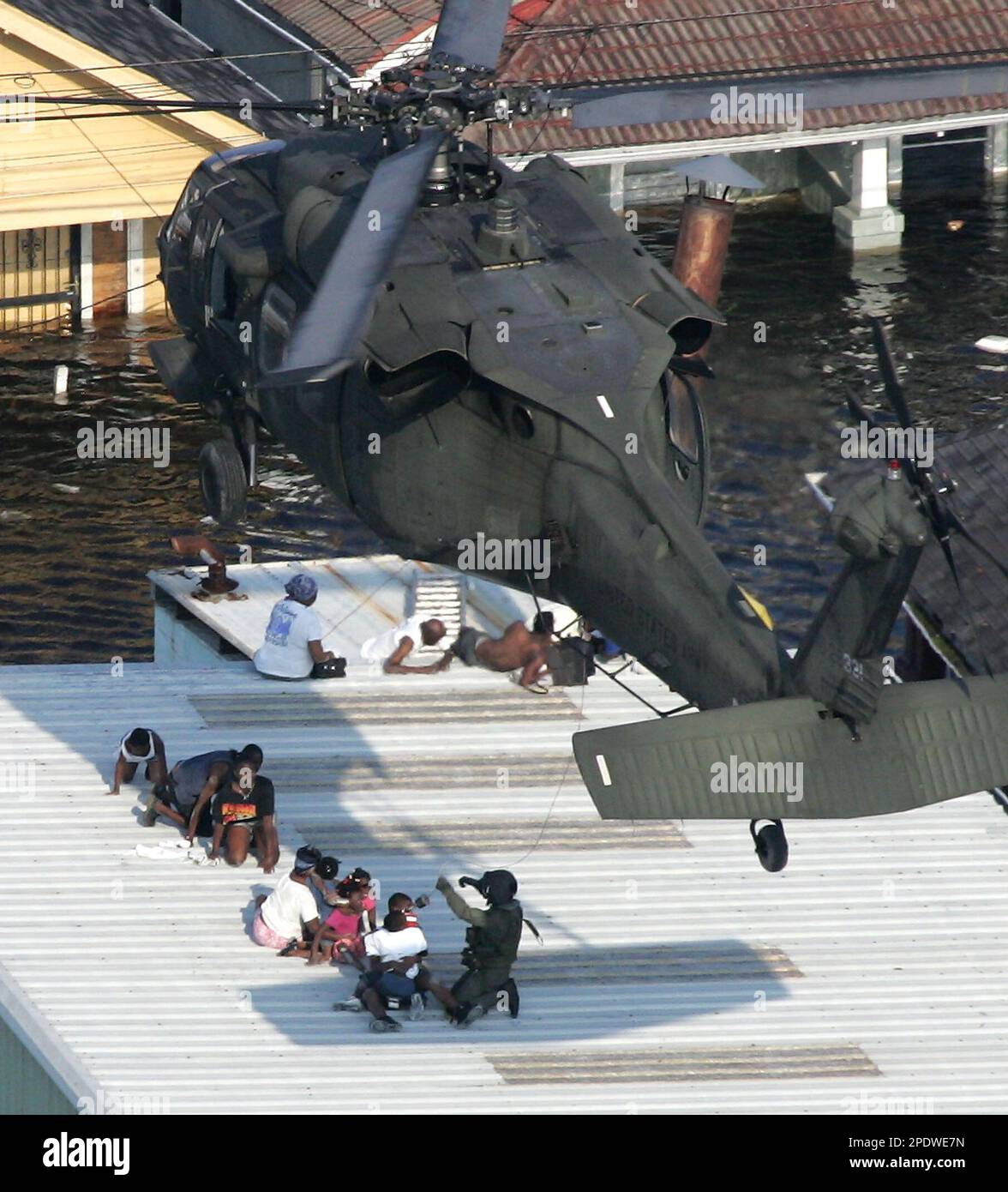 New Orleans residents are rescued by helicopter from the