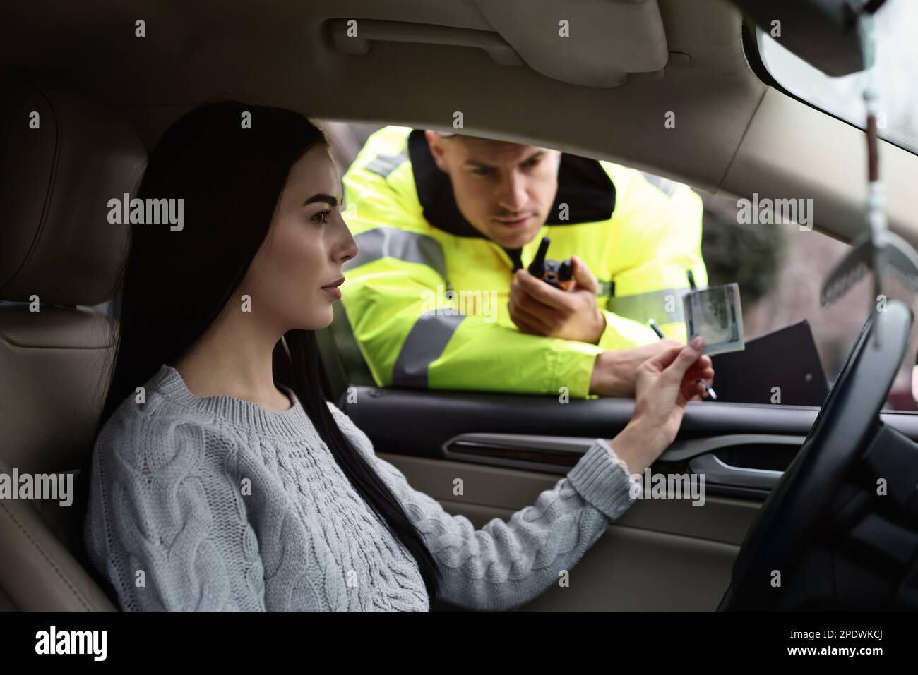 Woman giving bribe to police officer out of car window Stock Photo Alamy