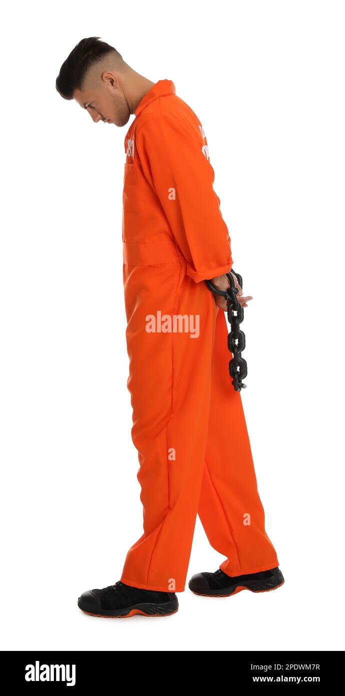 Prisoner in orange jumpsuit with chained hands on white background Stock Photo