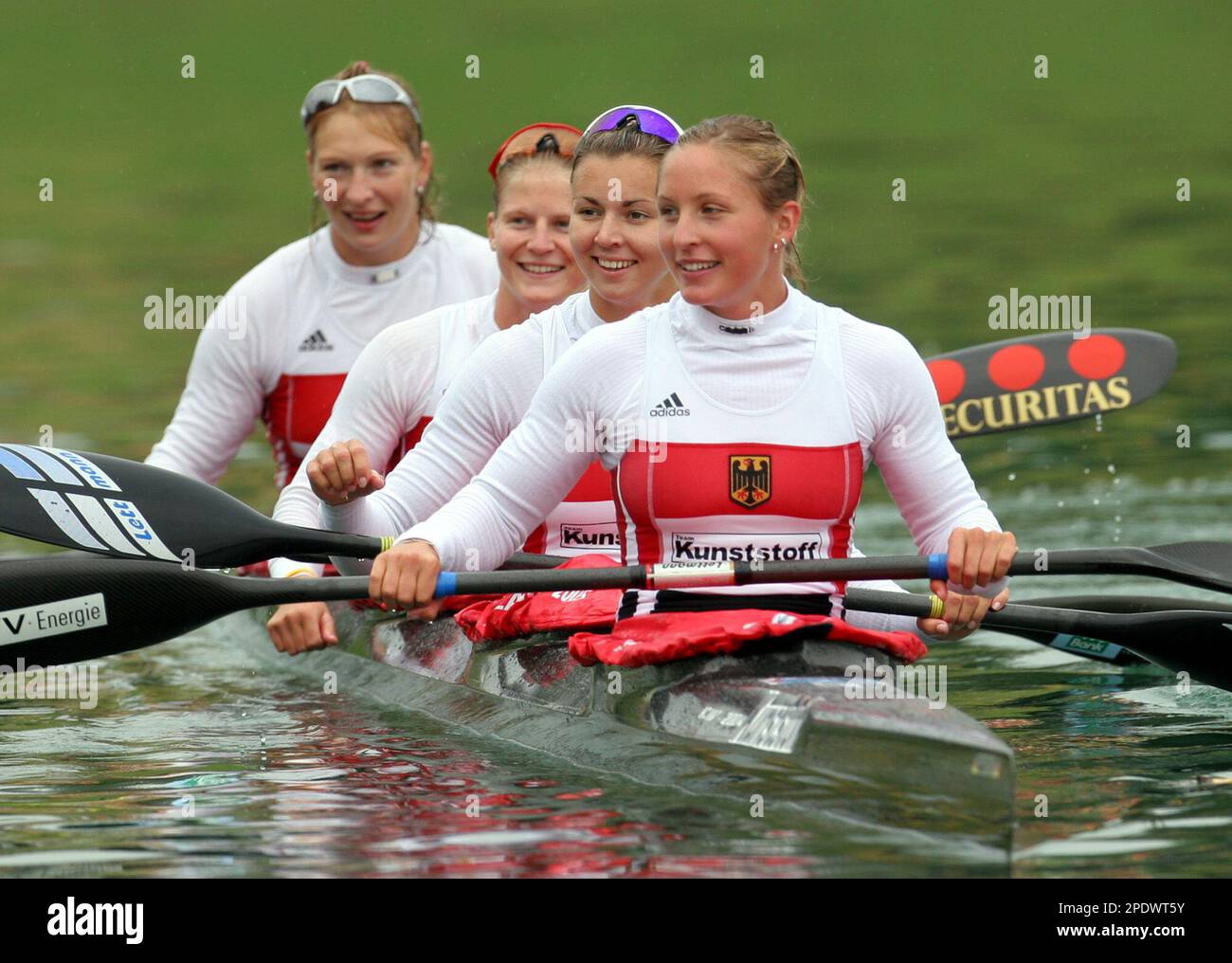 Germany's women K4 team, front to back, Caroline Leonhardt, Nicole Reinhardt,  Judith Hormann and Katrin Wagner-Augustin, smile at the finish area after  winning K4 200 meter race at 34th ICF Flatwater Racing, image size:1300x1016