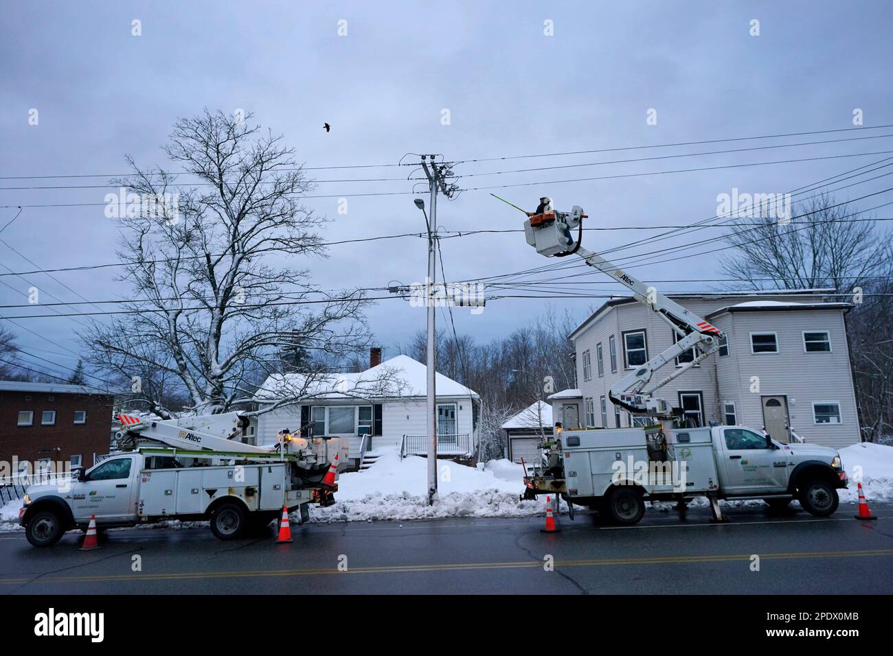 Central Maine Power Co. lineman John Baril works to restore electricity