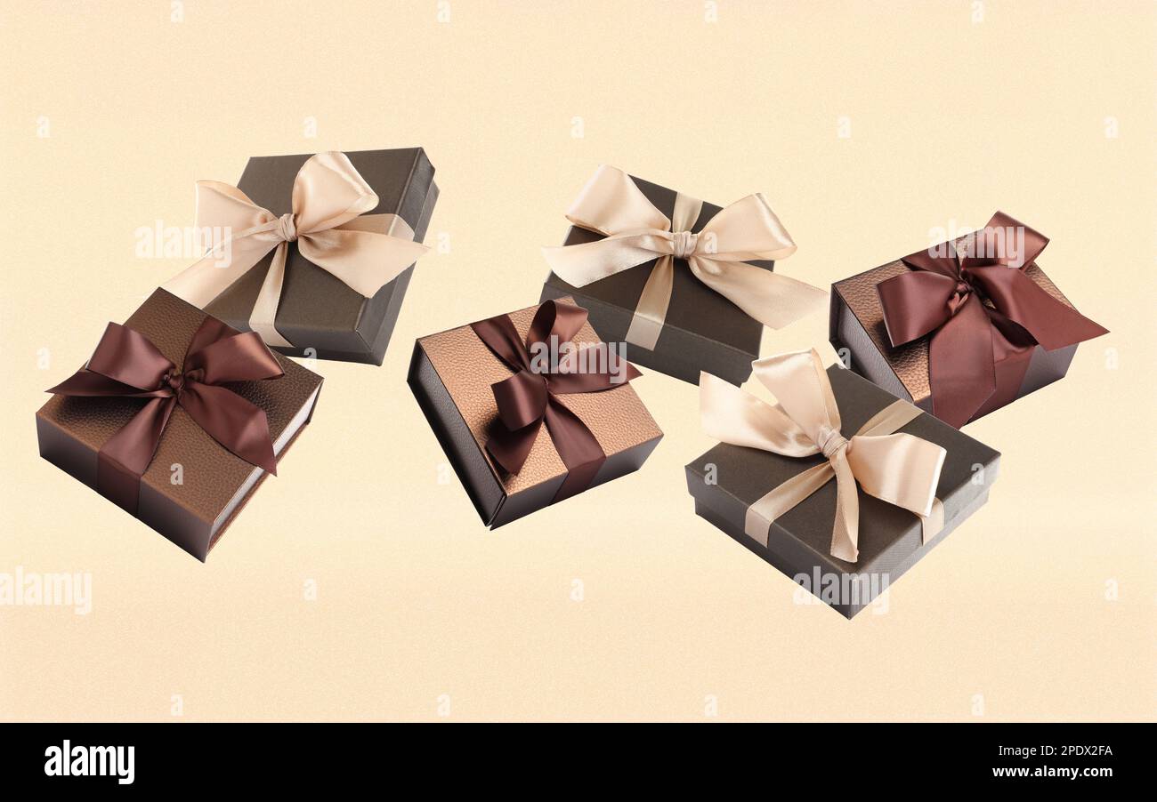 Beautifully wrapped gift boxes flying on light background Stock Photo