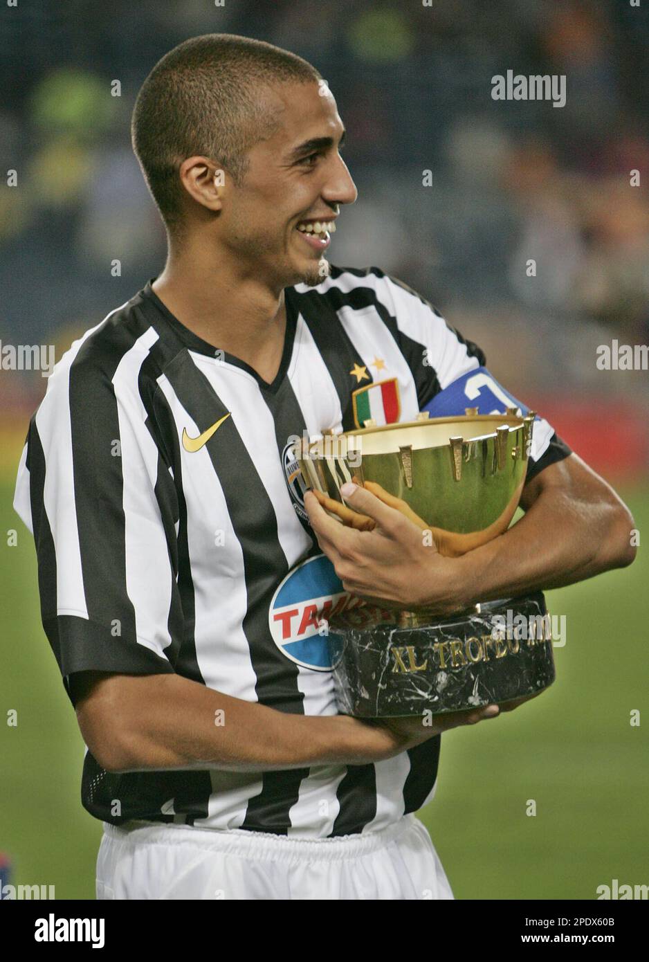 Juventus' David Trezeguet holds the Joan Gamper trophy after