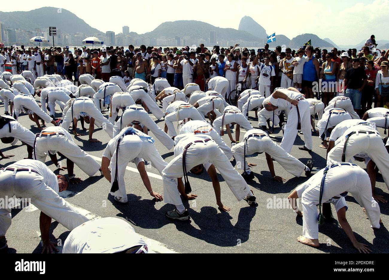 Hundreds of participants from various countries perform Capoeira, a blend  of dance, music and martial art,on the last day of Fifth World Capoeira  Games at Copacabana beach, Rio de Janeiro, Brazil, Sunday,