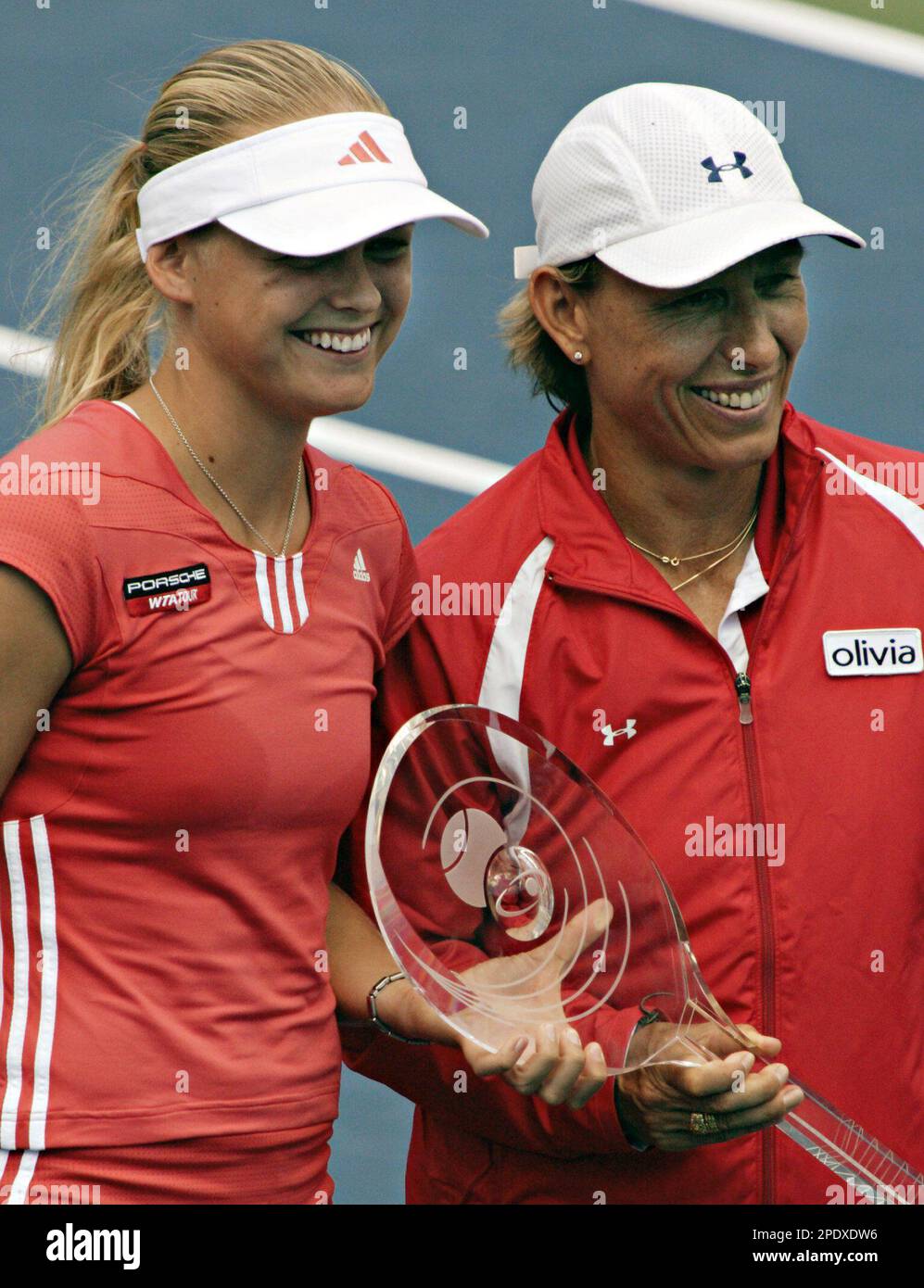 Anna-Lena Groenefeld, left, of Germany, and Martina Navratilova, right, of  the USA, pose with the trophy after they defeated Conchita Martinez and  Virginia Ruano Pascual, of Spain, in the doubles final at