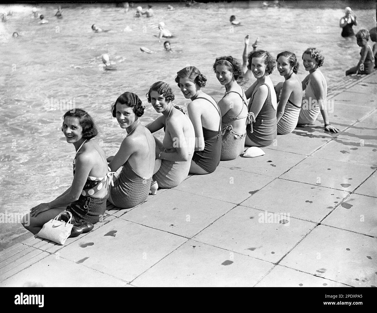 Bathing beauties ladies in swimsuits at the open-air swimming pool in ...