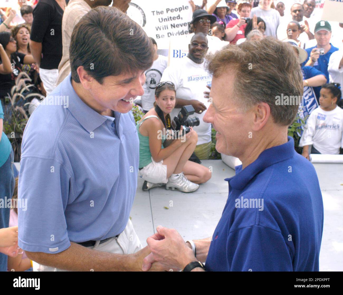 Gov. Rod Blagojevich shakes hands with House Speaker Mike Madigan, D ...