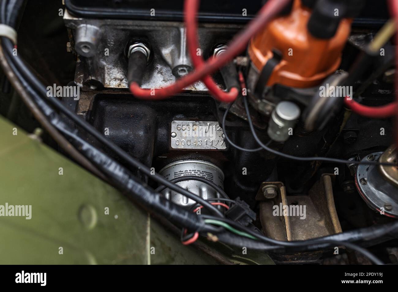 Detail shot of the engine, spark plugs and distributor cap of an